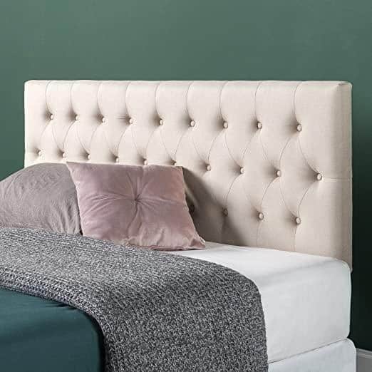 A tufted headboard can be used for sitting up and reading in bed