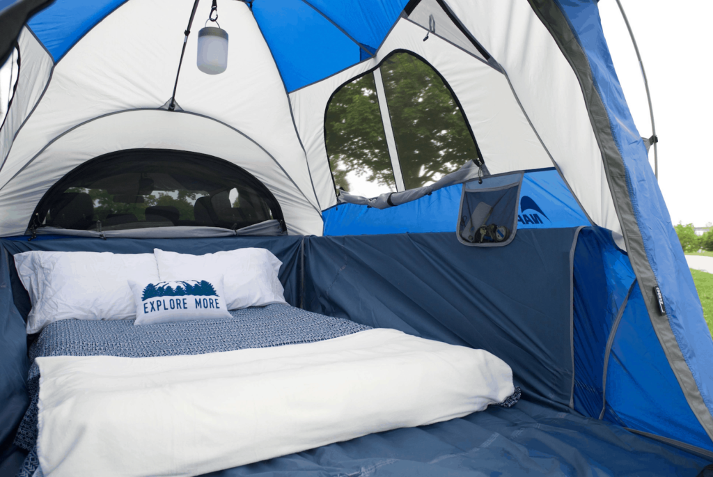 To make a comfortable truck camping bed, use an air mattress, mattress topper or pad, and a temperature rated sleeping bag. 