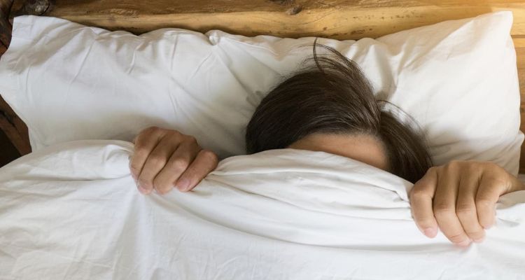 sleeping with blanket over head