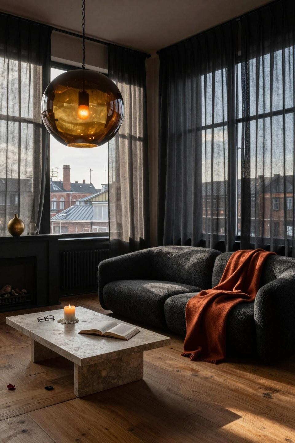 Moody minimalist living room with sculptural pendant and clean lines