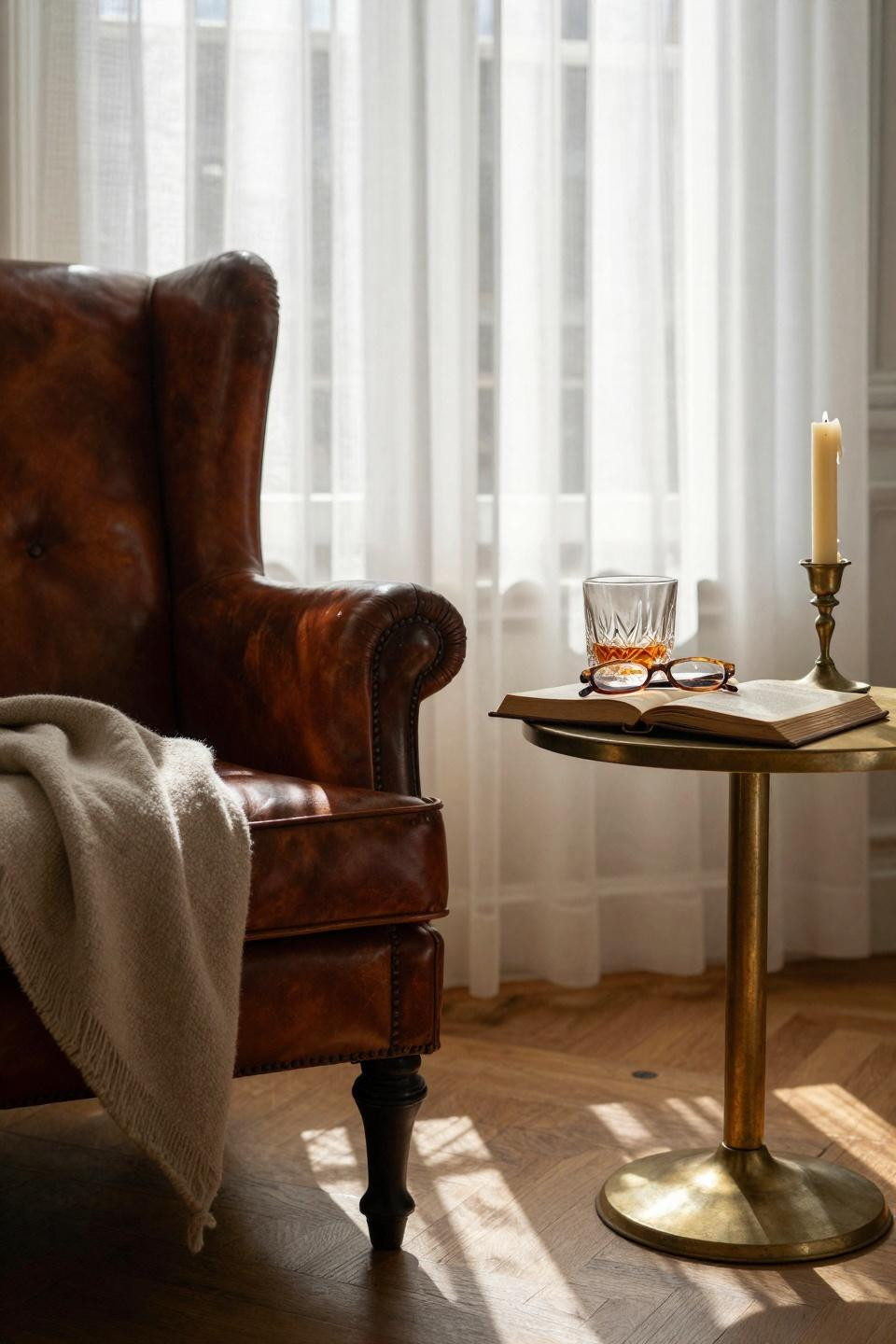 sitting room ideas - intimate parisian corner with cognac leather and brass details