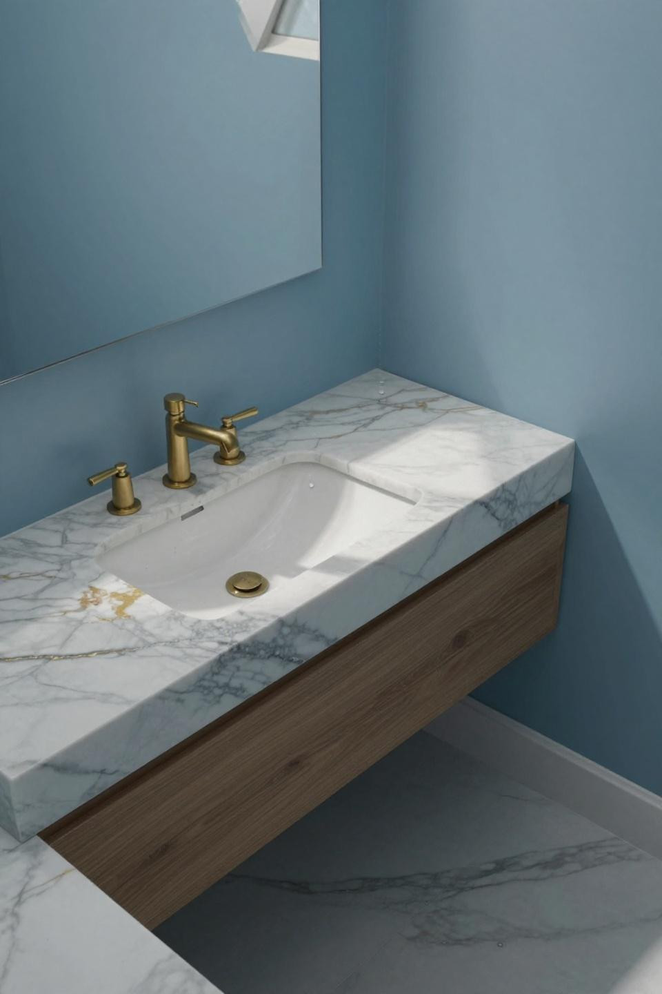 glacier-blue bathroom paint dominating walls with calacatta marble featuring gold veining and floating walnut vanity