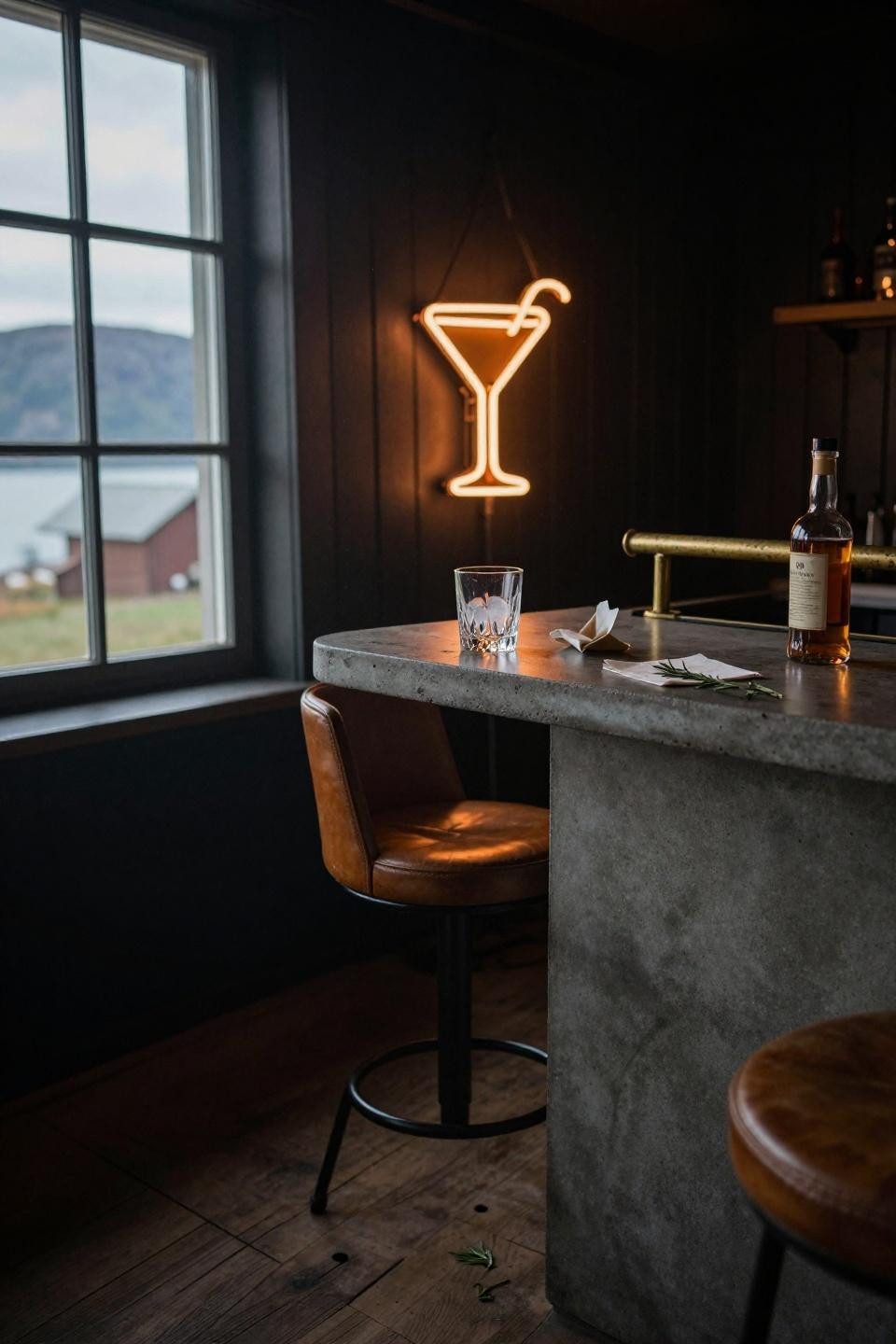 scandinavian barn house bar corner with poured concrete counter custom neon cocktail sign and cognac leather stool near black shiplap