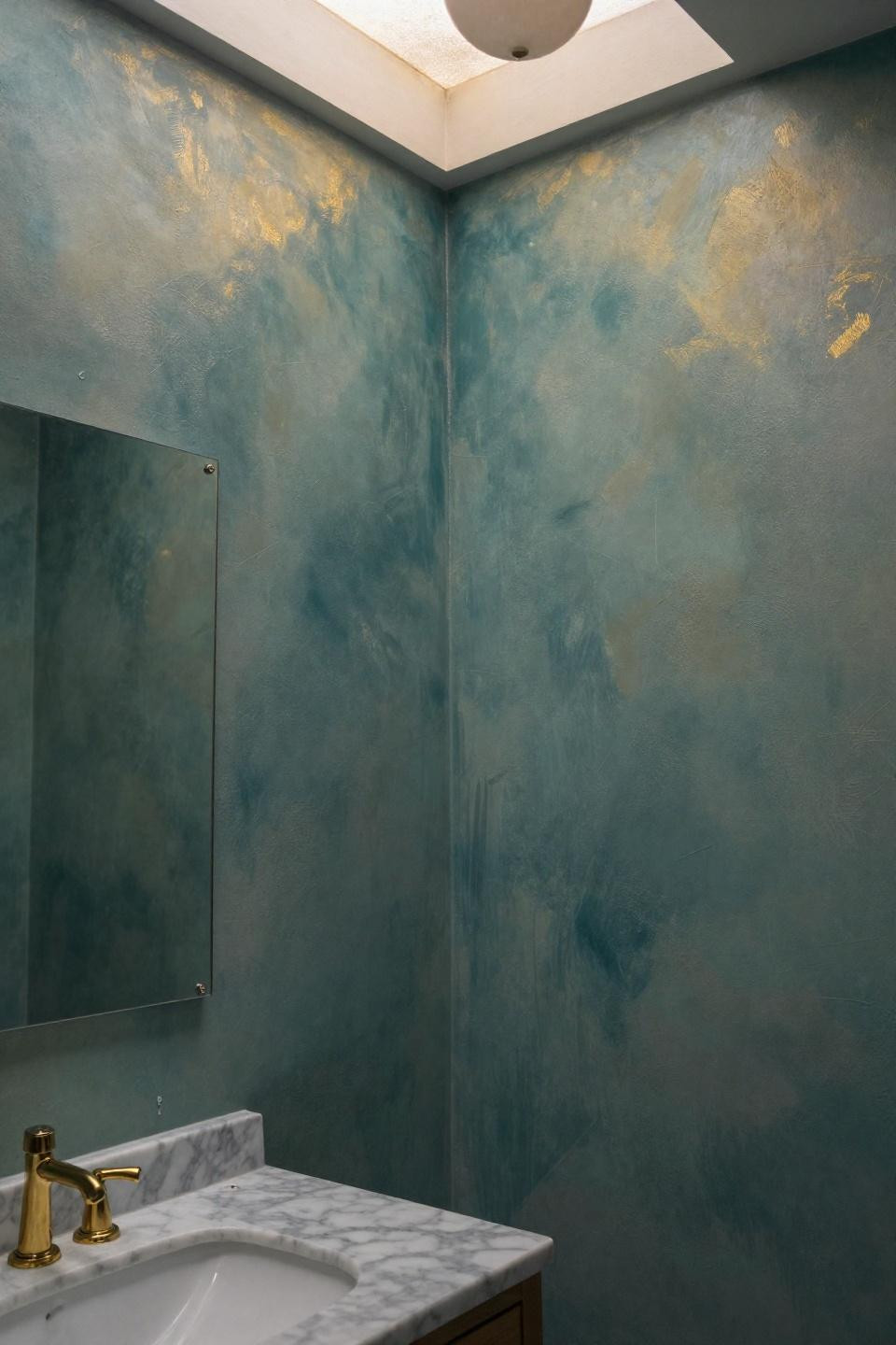 best bathroom colors featuring teal-to-sage ombre venetian plaster with microscopic mica particles and carrara marble vanity