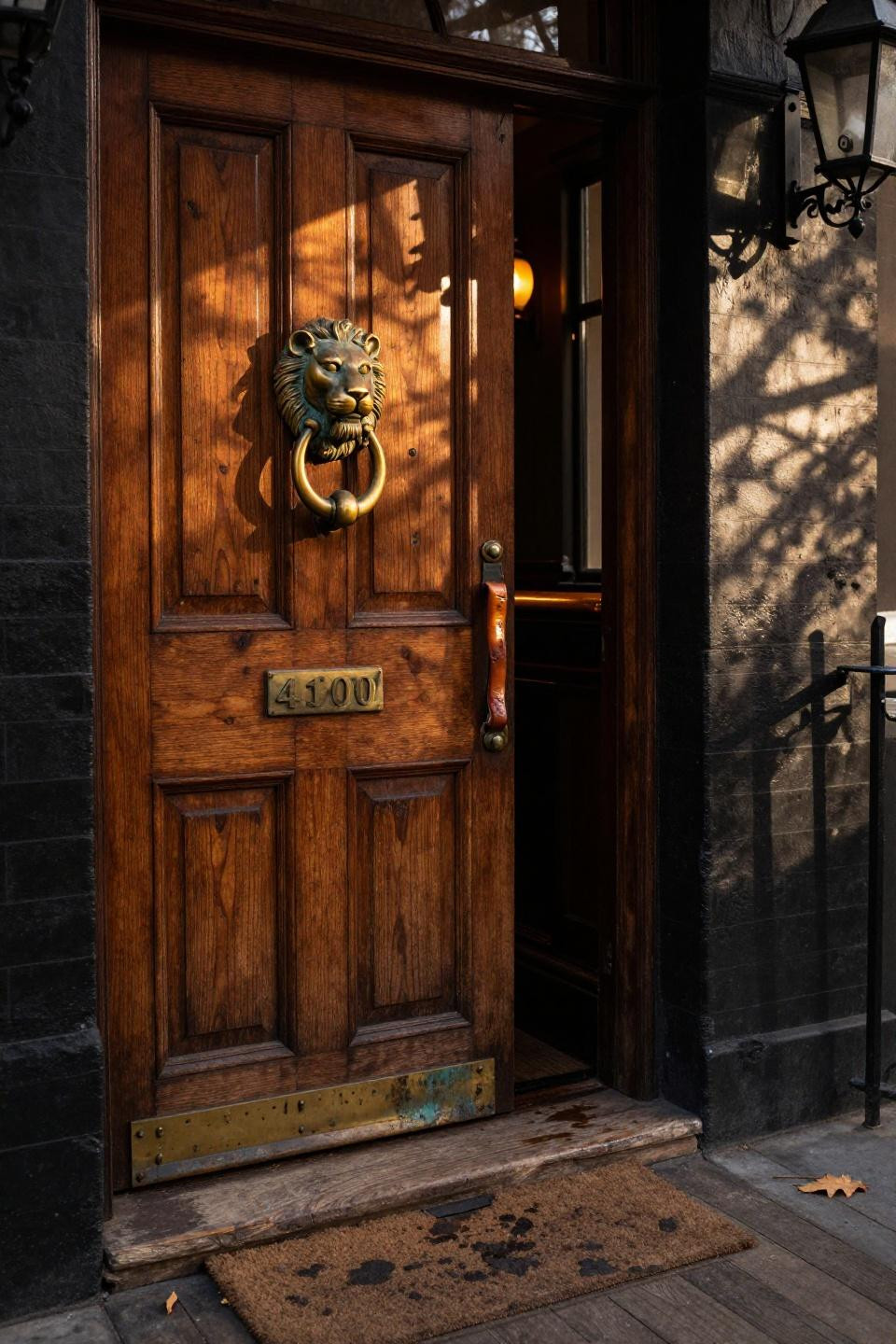 speakeasy bathroom - carved mahogany door with brass lion knocker