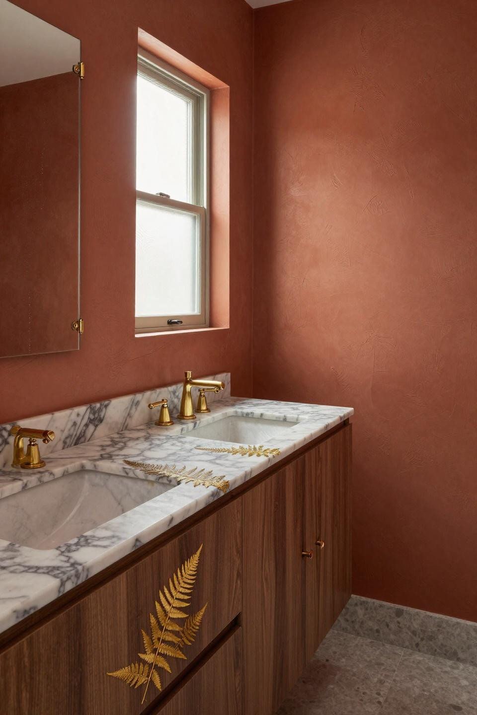 terracotta venetian plaster bathroom walls with hand-troweled texture and walnut vanity featuring unlacquered brass fixtures