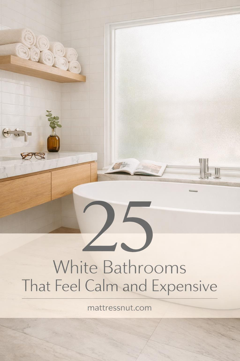 Bright white bathroom featuring marble countertops, chrome fixtures, white subway tiles, and minimalist decor elements