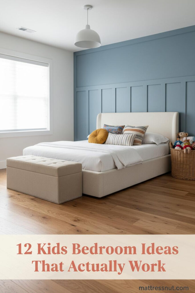 Kids bedroom with dusty blue board-and-batten wall, honey oak floors, cream bedding, colorful pillows, low-profile bed, and woven toy basket