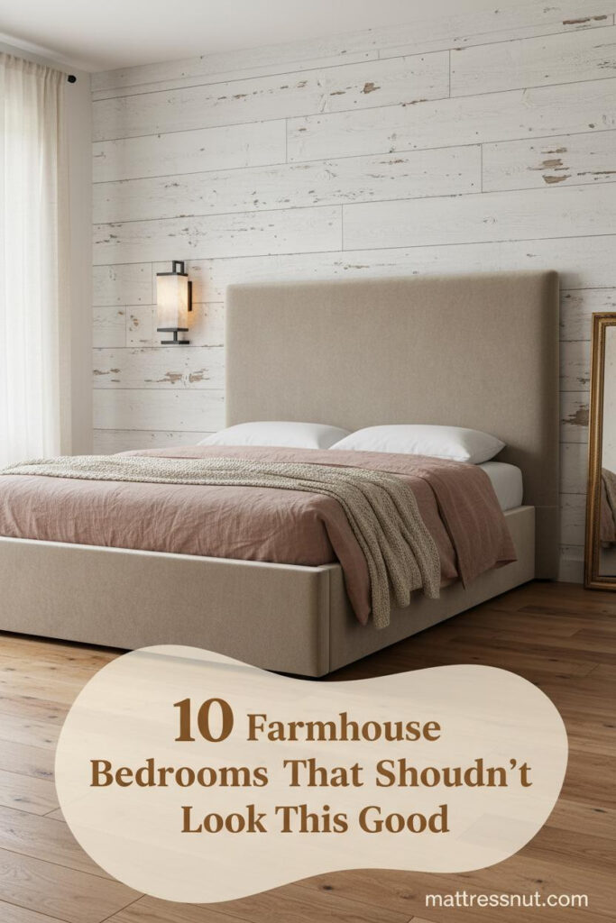Farmhouse shabby chic bedroom with whitewashed shiplap wall, dusty rose linen bedding, oatmeal throw, and warm amber sconce lighting
