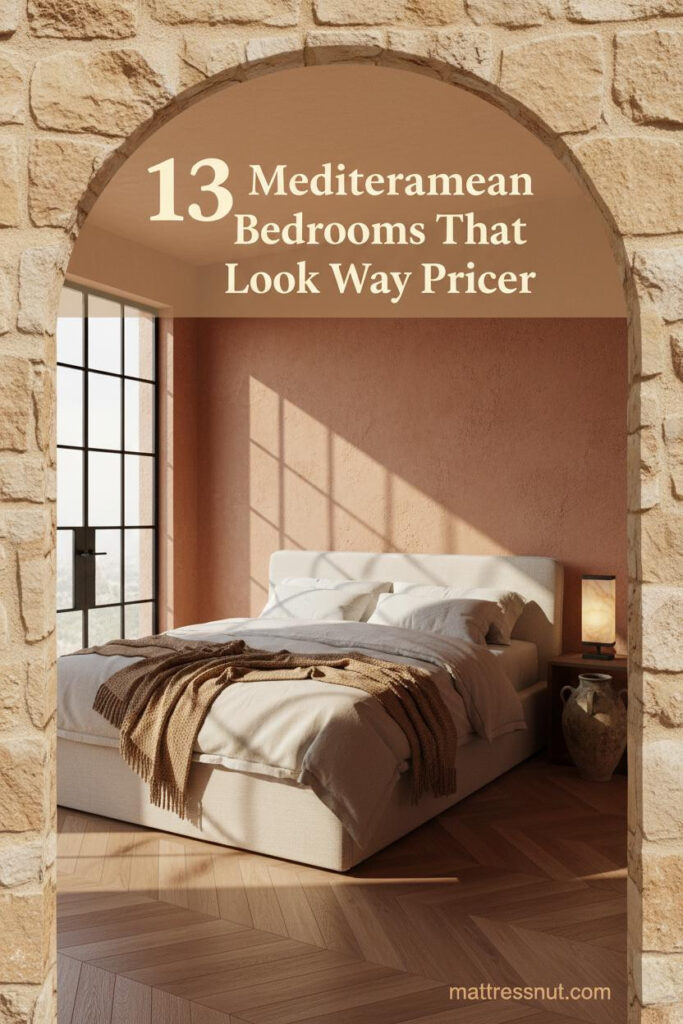 Deep Mediterranean bedroom with ochre limestone arch, terracotta lime-washed walls, honey oak herringbone floors, cream linen bedding and camel wool throw