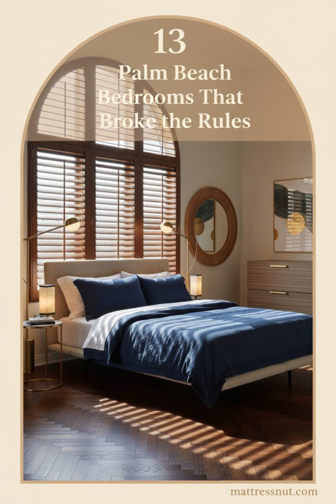 Palm Beach bedroom with ivory plaster walls, navy linen bedding, walnut herringbone floors, brass sconces, and rattan mirror leaning against wall
