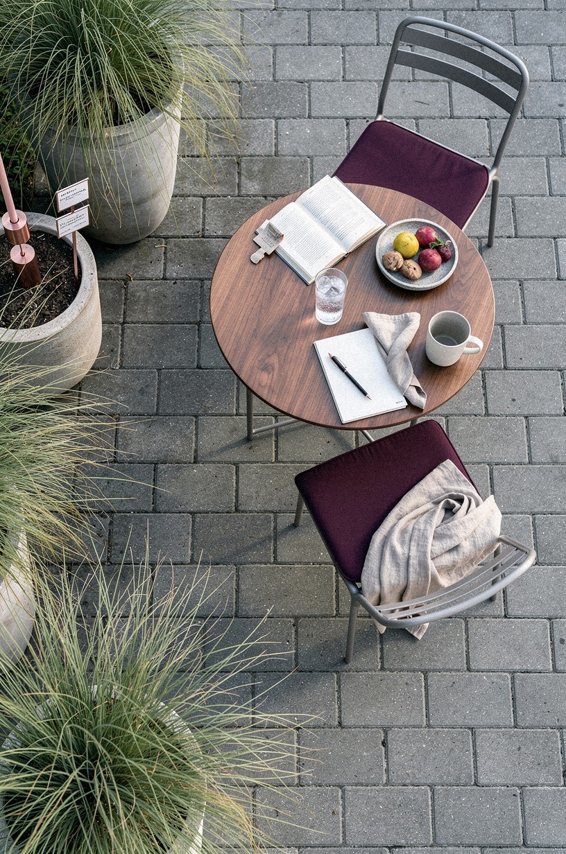 Anchor a bistro set with potted grasses