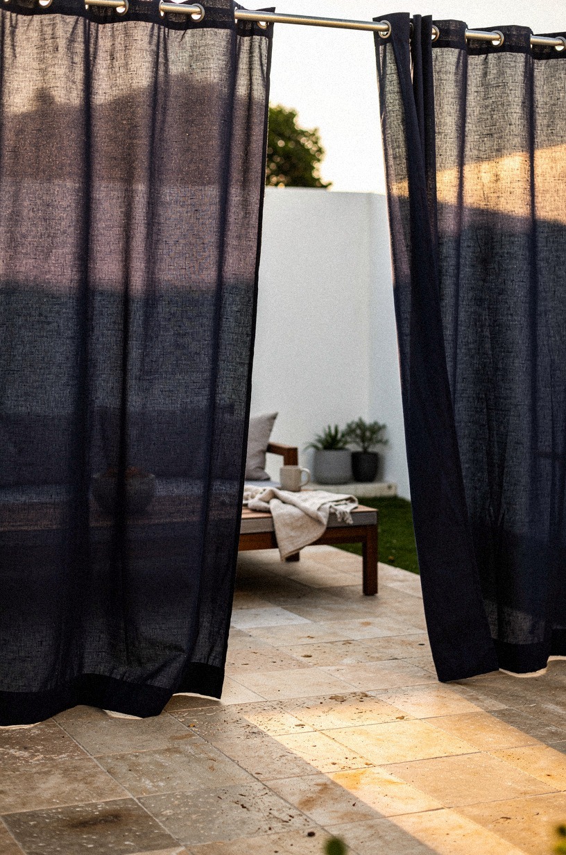 Drape outdoor curtains on a simple galvanized rod