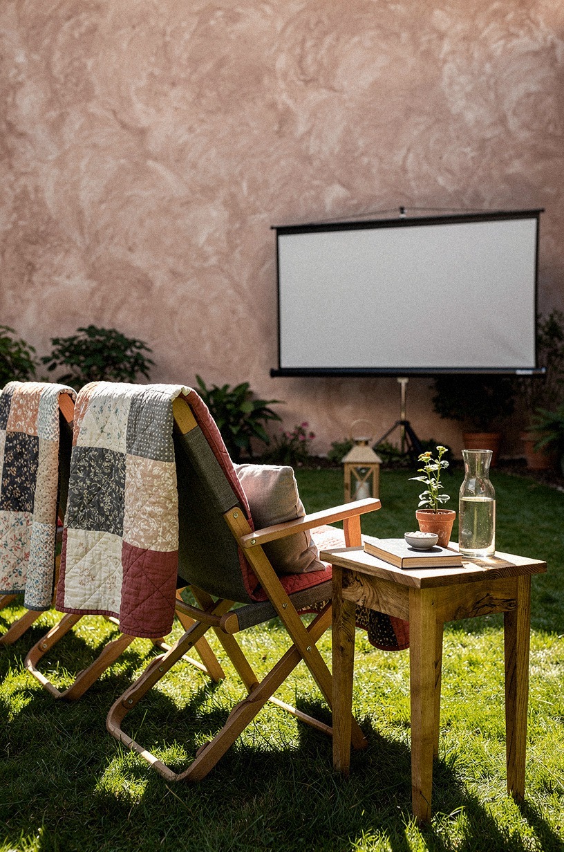 Drape quilts over mismatched folding chairs
