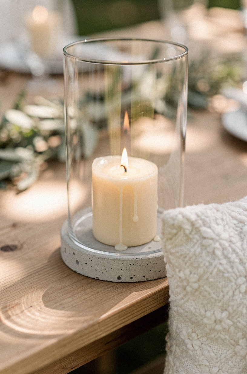 Set taper candles inside hurricane glass