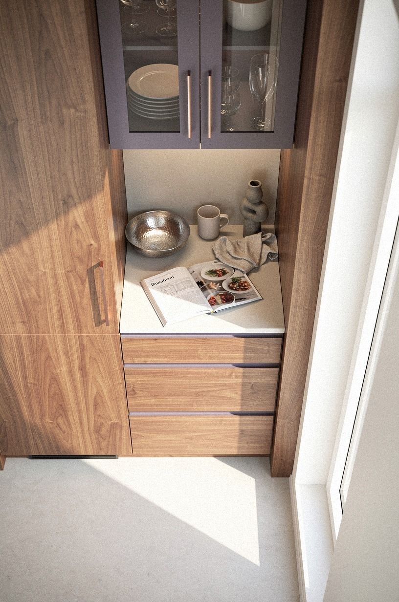 Why does a glass-front focal cabinet anchor the far end?