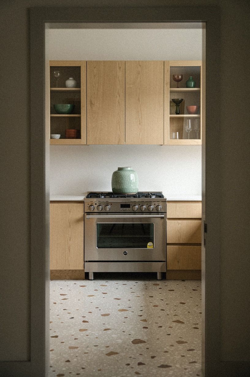 Install glass oak cabinets beside the range