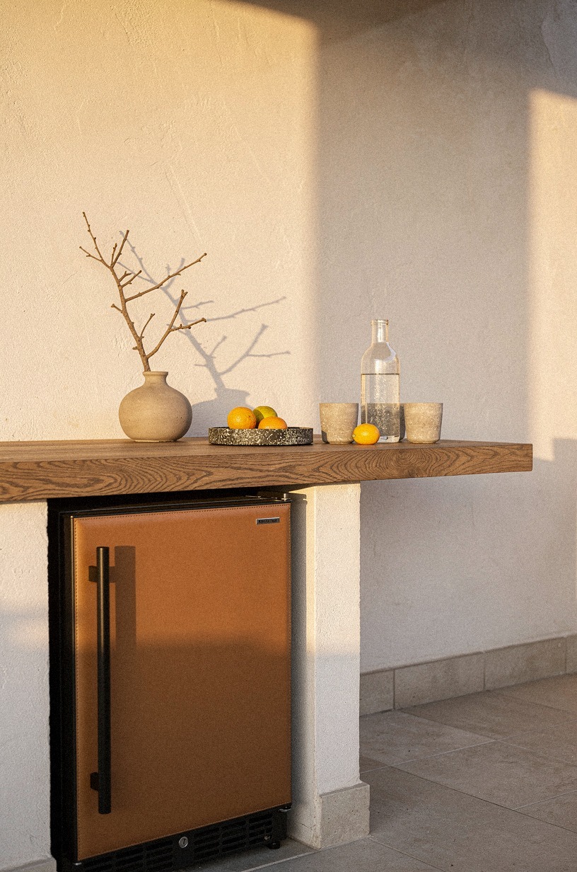 Tuck a beverage fridge into the side wall