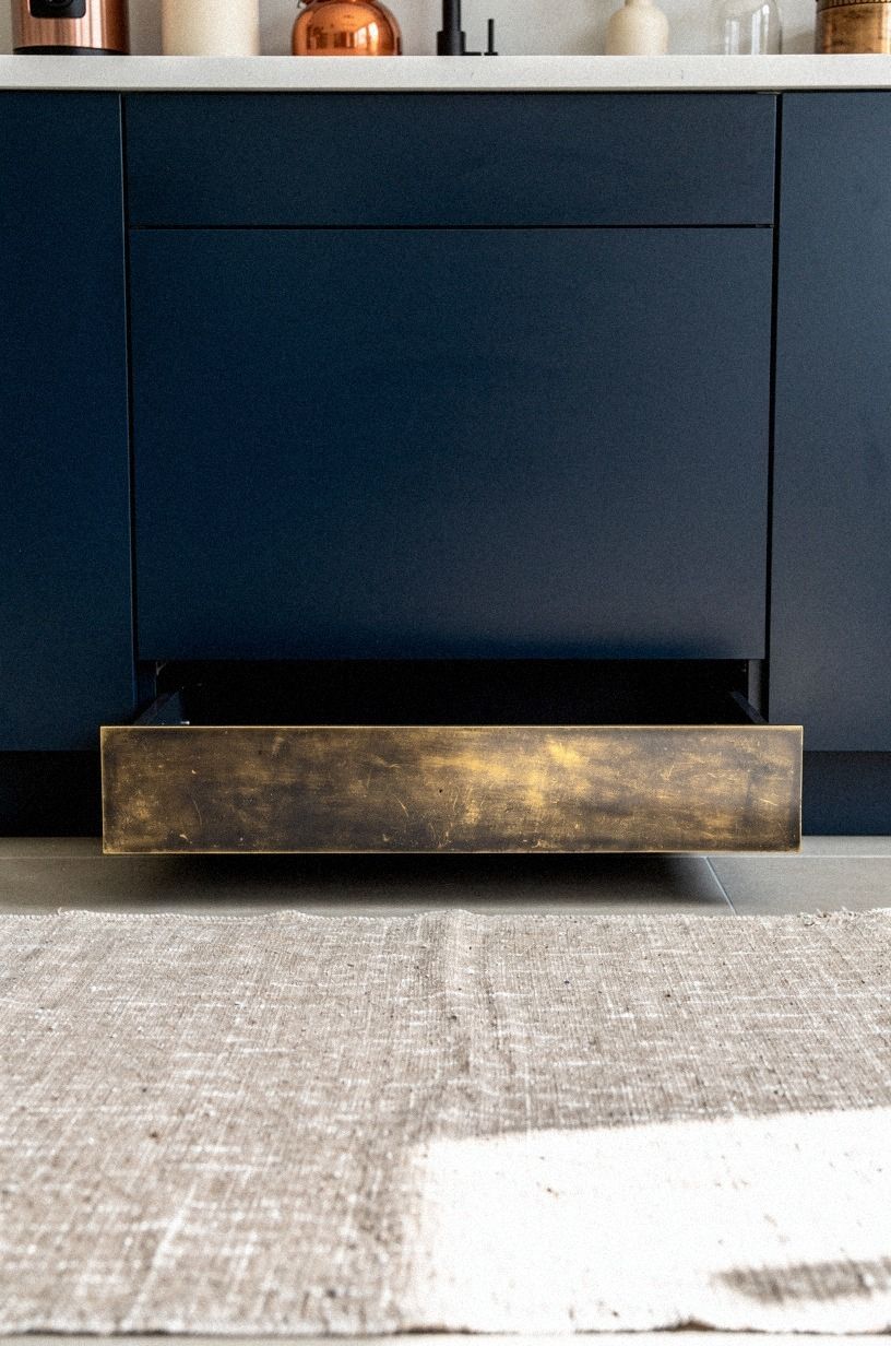 Use toe-kick drawers under base cabinets