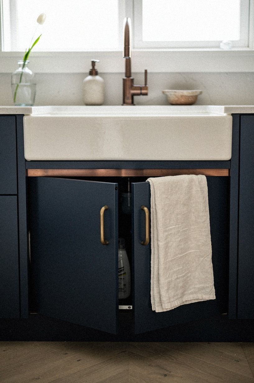 Hide cleaning bottles behind pocket doors