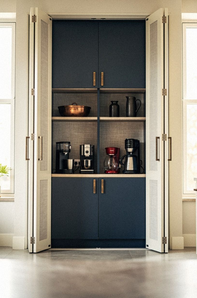 Build a hidden appliance garage behind pocket doors