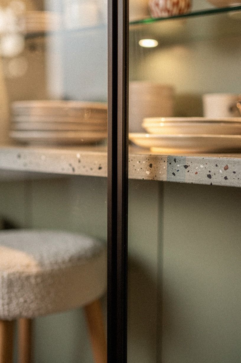 Use black mullions to frame bright dishware