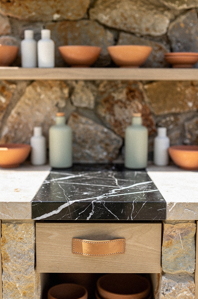 Install open shelves on the stone backsplash