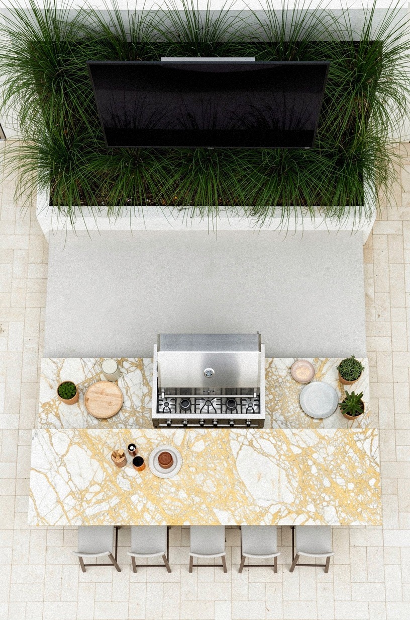 Plant tall grasses behind the TV wall