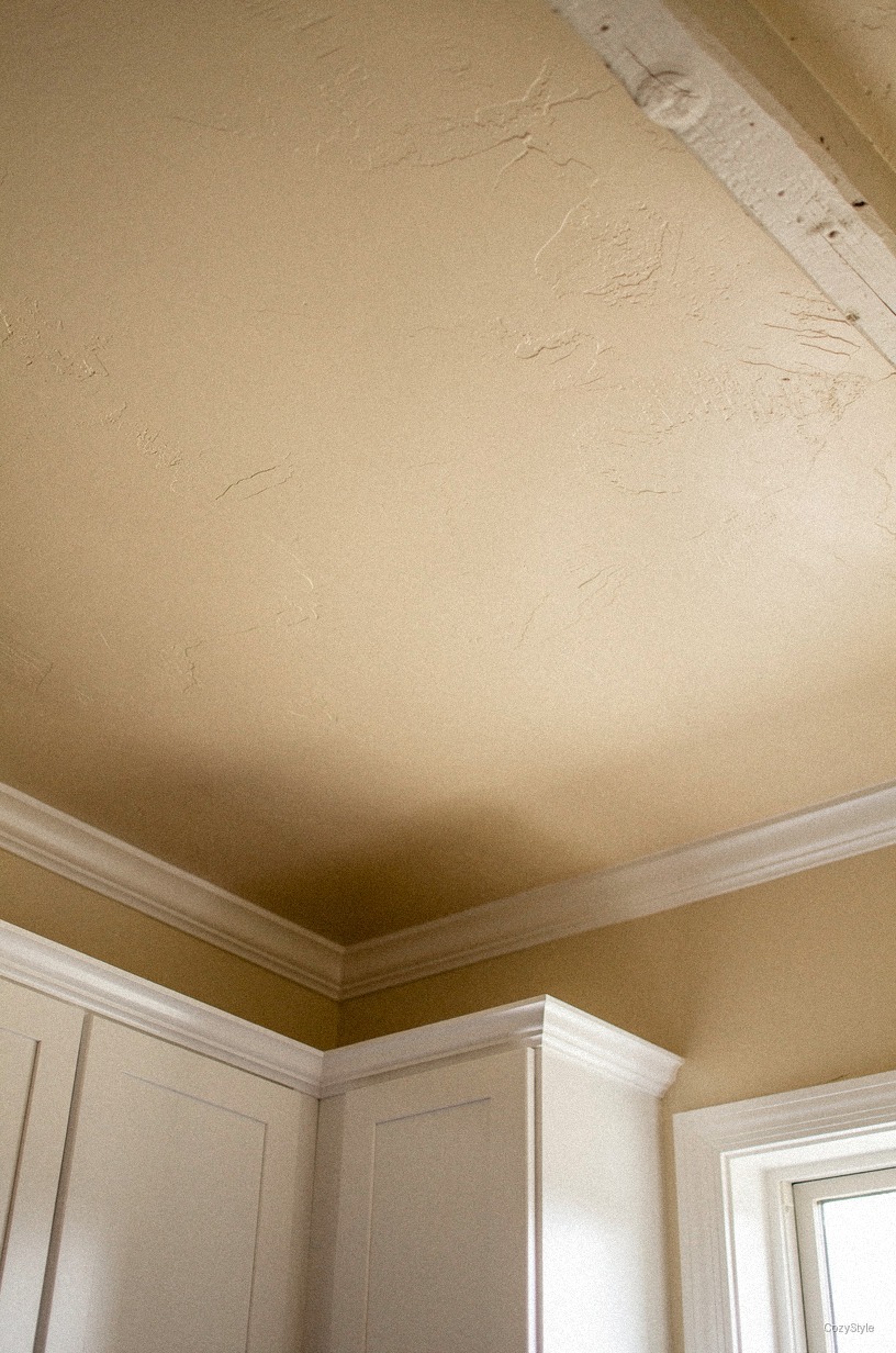 Paint the ceiling <strong>soft cream</strong> instead of white