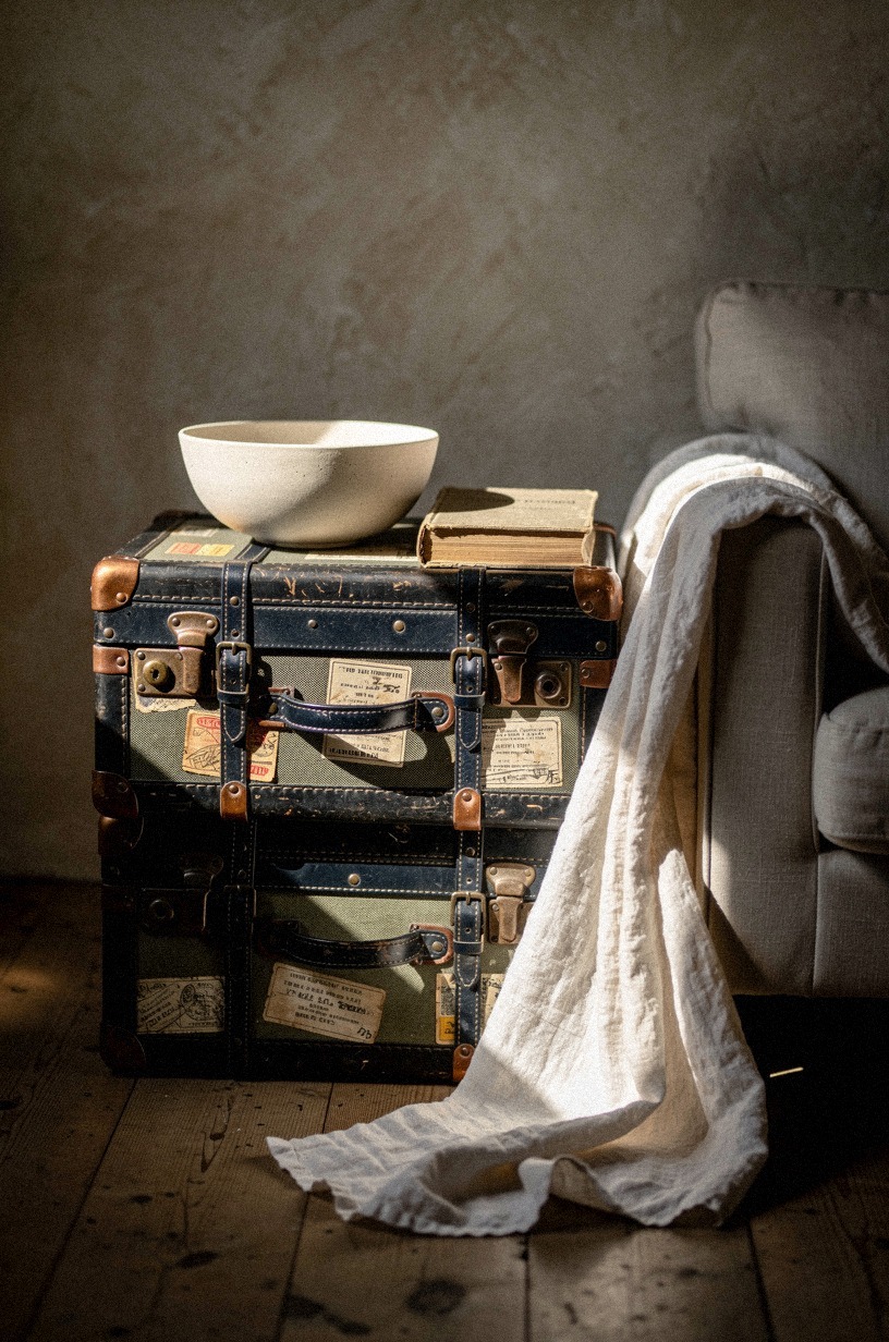 Stack vintage trunks as a side table with hidden blanket storage