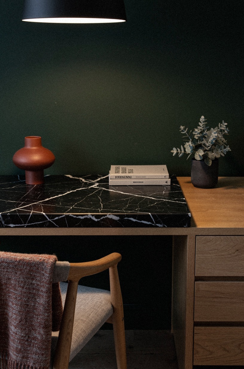 Paint the wall behind the desk in a deep, quiet green