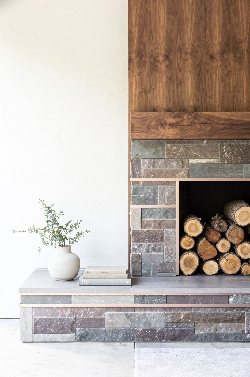 Stack cut logs under the mantel as decor