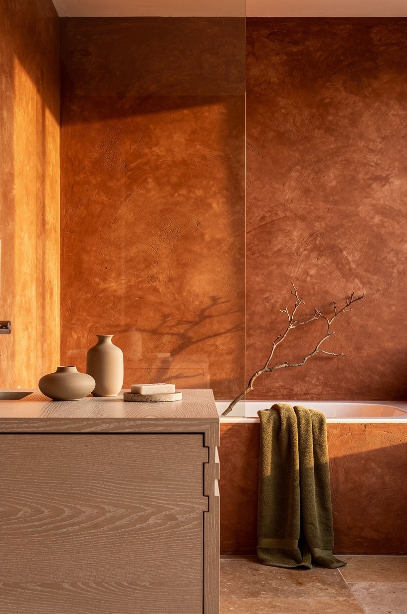 Wrap the shower walls in warm plaster (The Cocoon Shower Move)