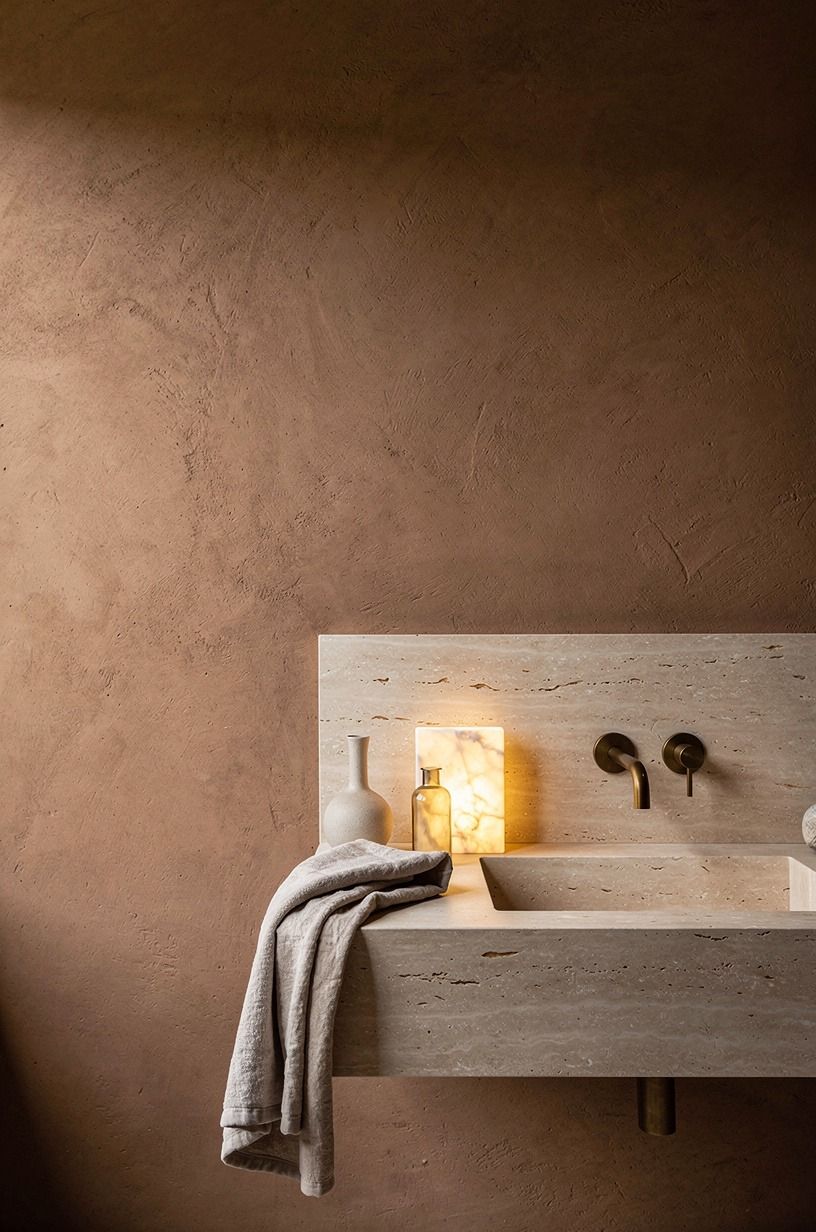 Run limestone slabs behind the vanity