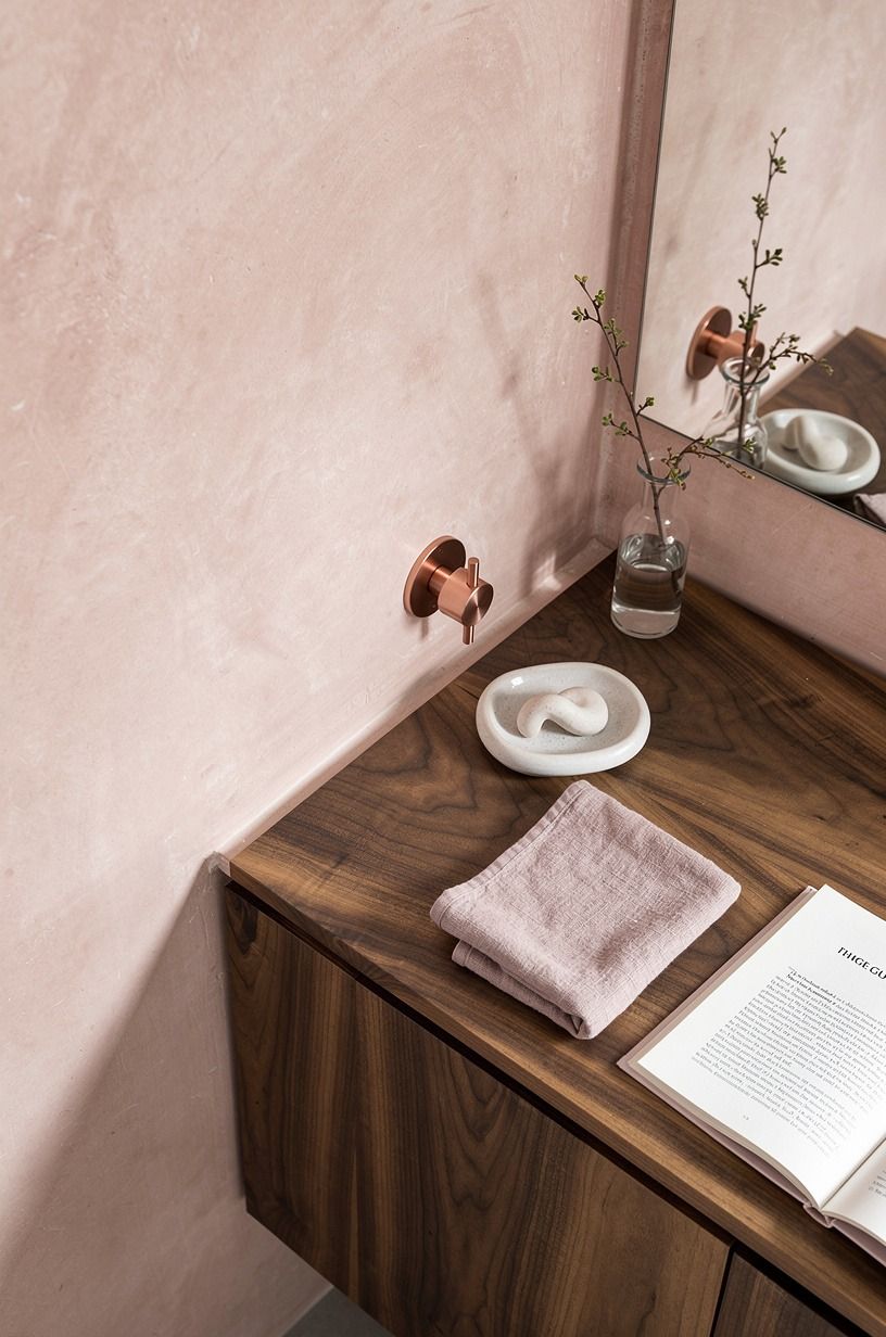 Seal the vanity backsplash in blush plaster