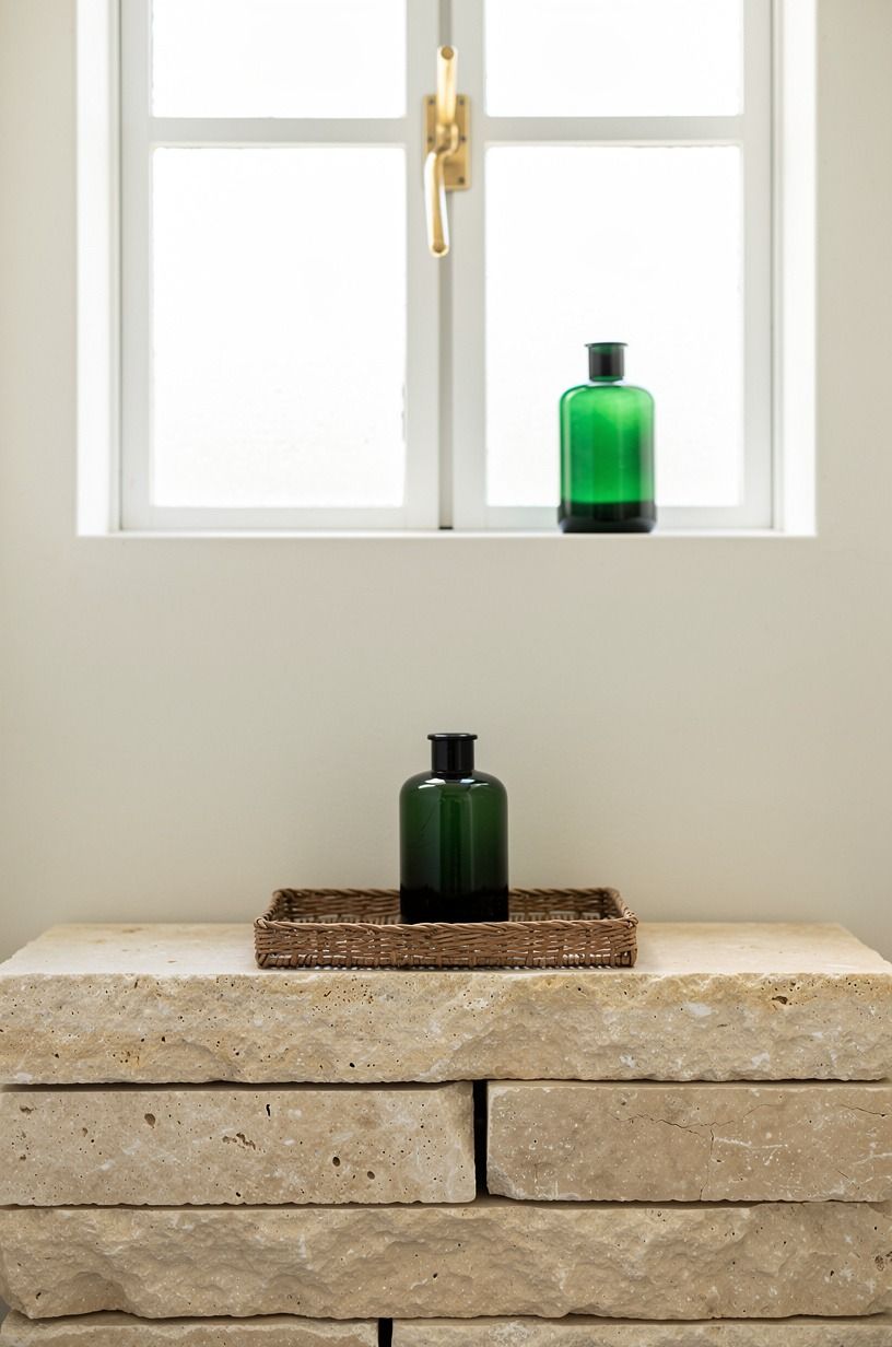 Stack tumbled limestone ledges by the window