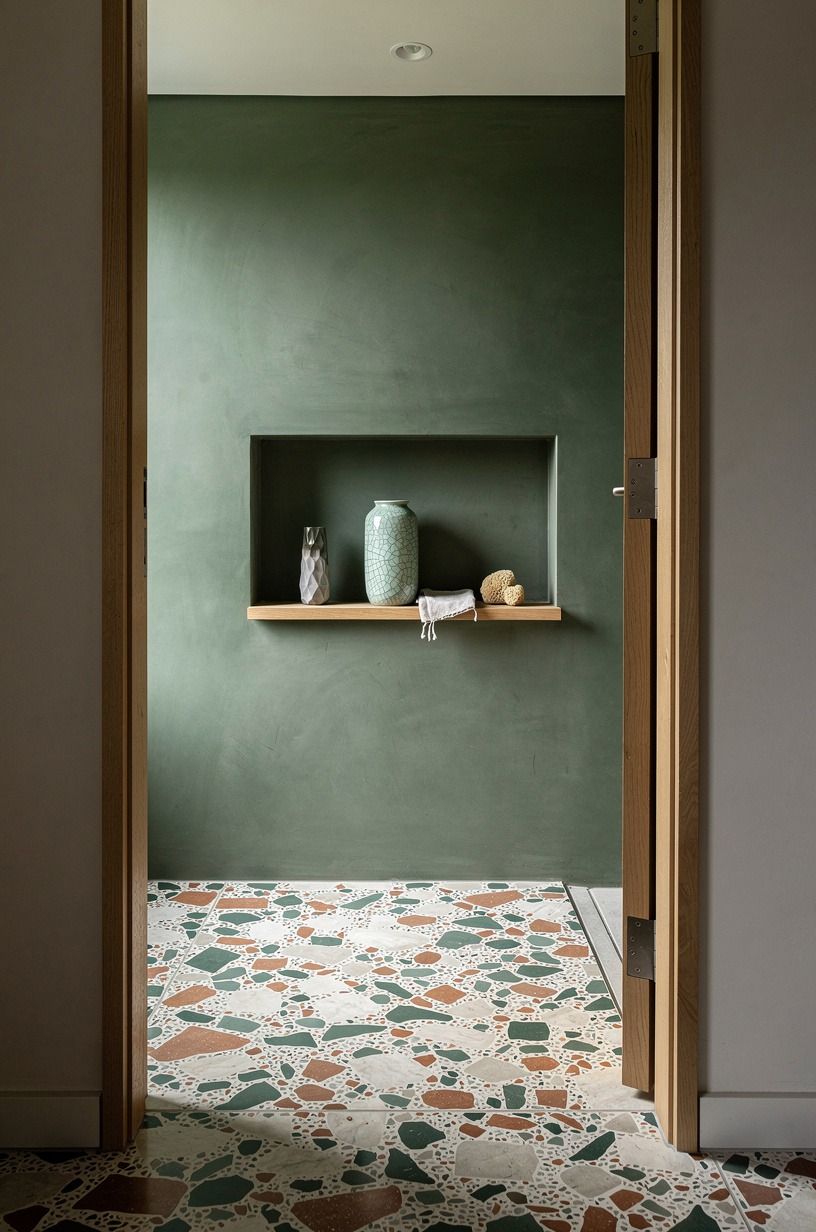 Carve a recessed microcement shampoo niche