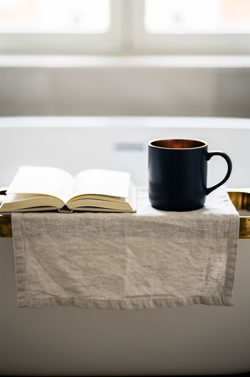 Place a paperback beside a ceramic mug