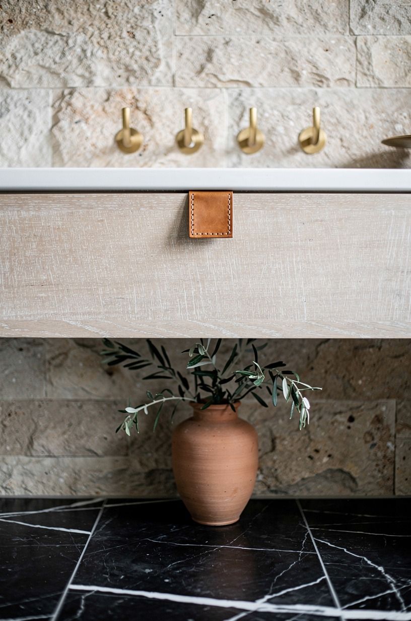 Pair limestone with unlacquered brass hooks