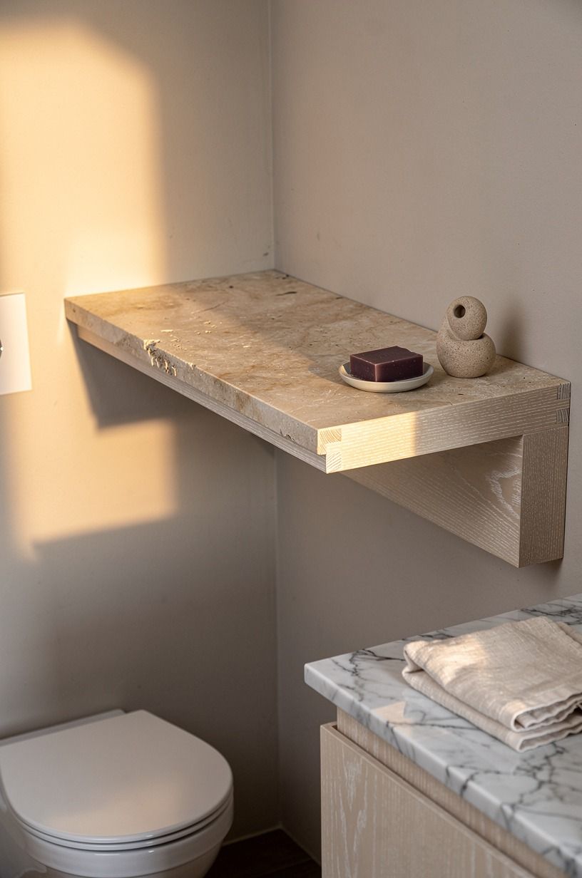Float a limestone shelf above the toilet