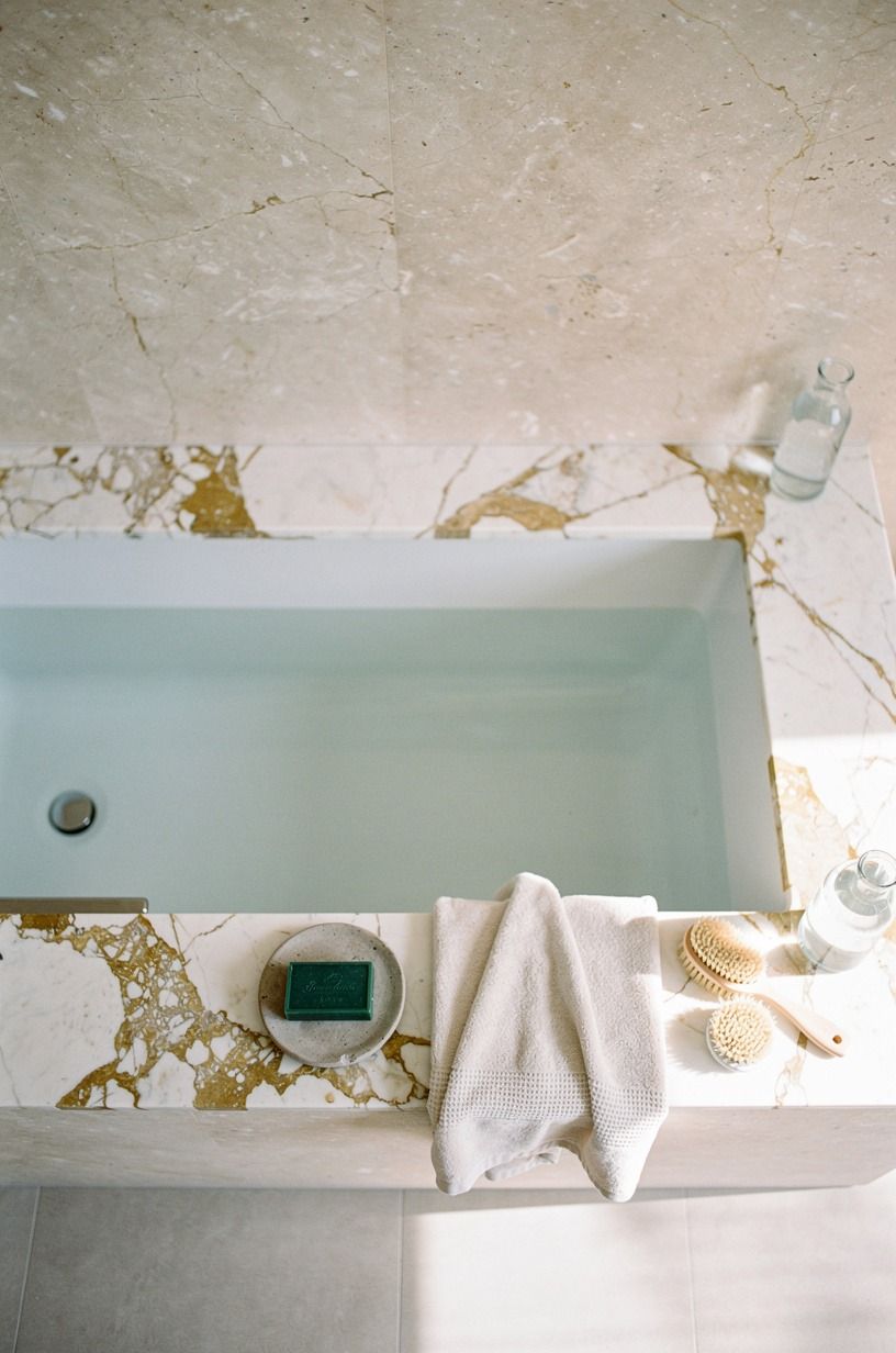 Carry limestone all the way up the tub wall