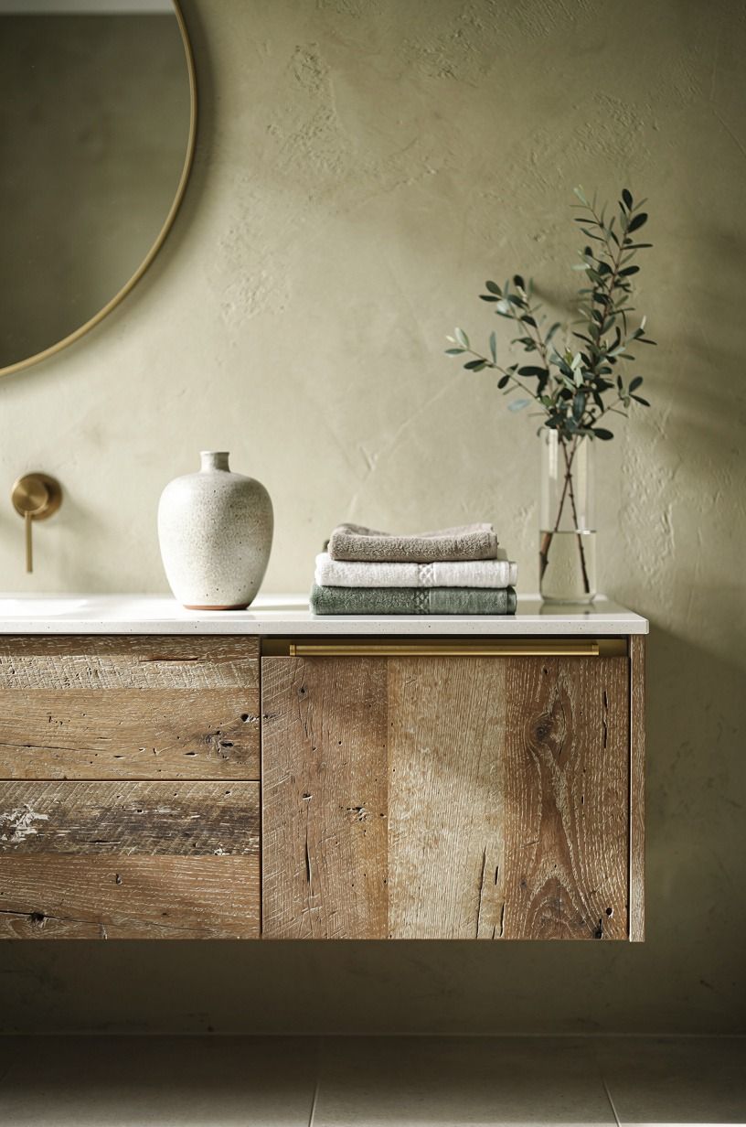 Float a white-oak vanity against warm plaster