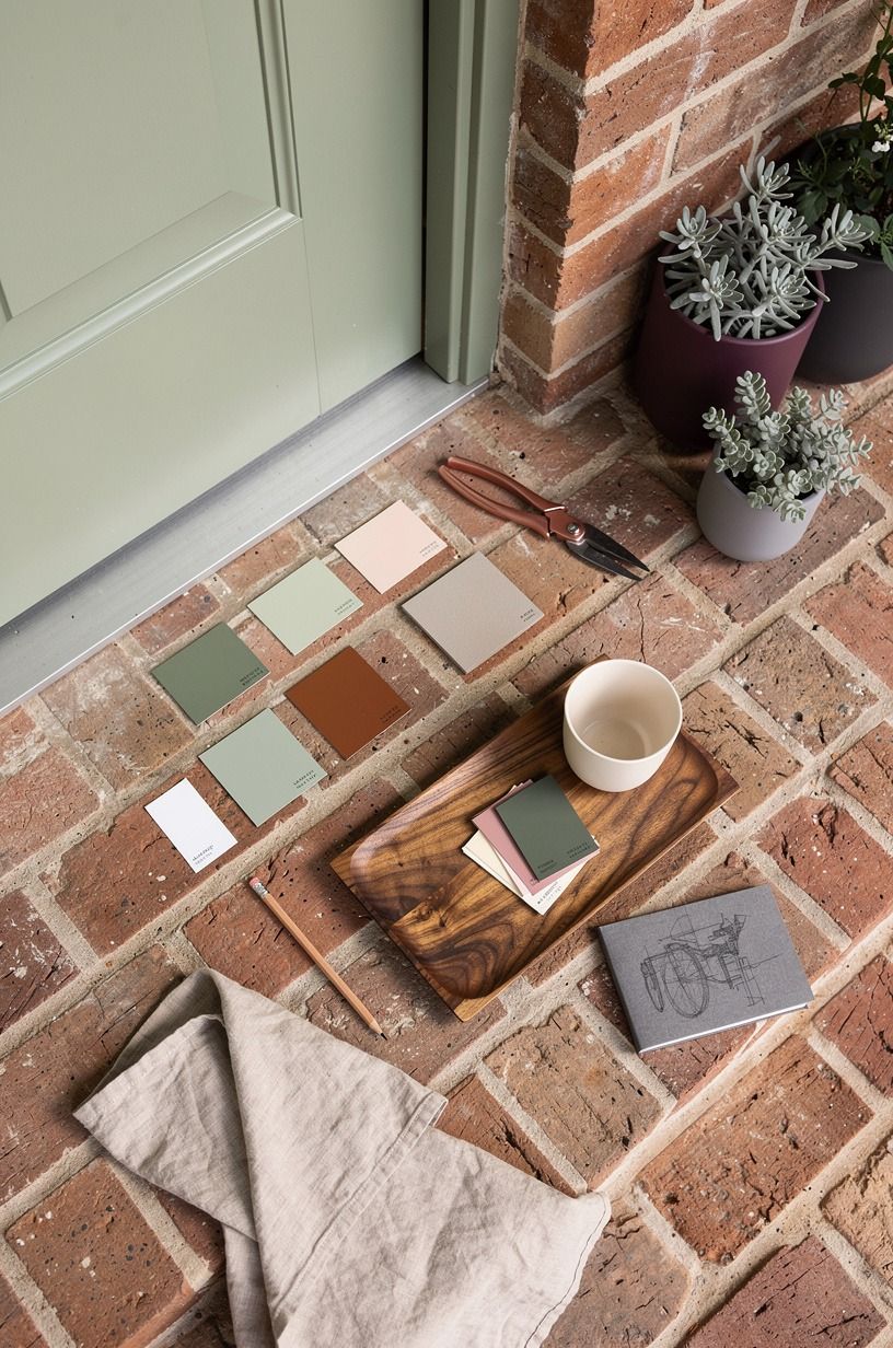 Use sage green to soften brick steps