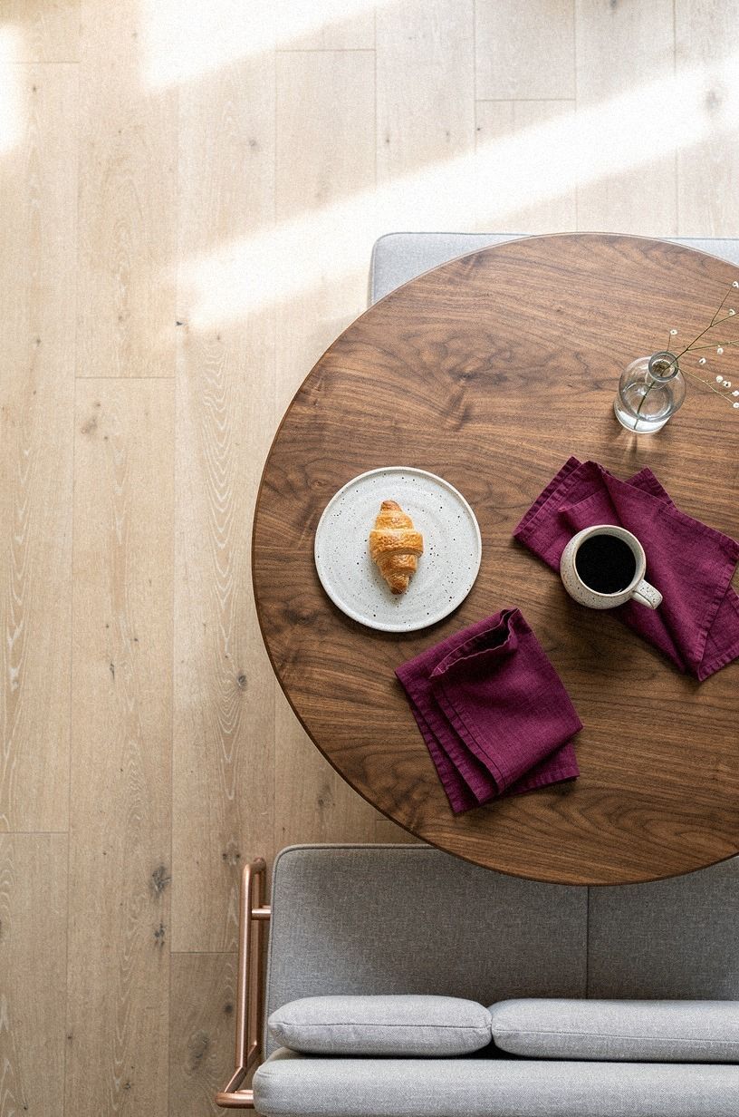 Anchor the nook with a round pedestal table
