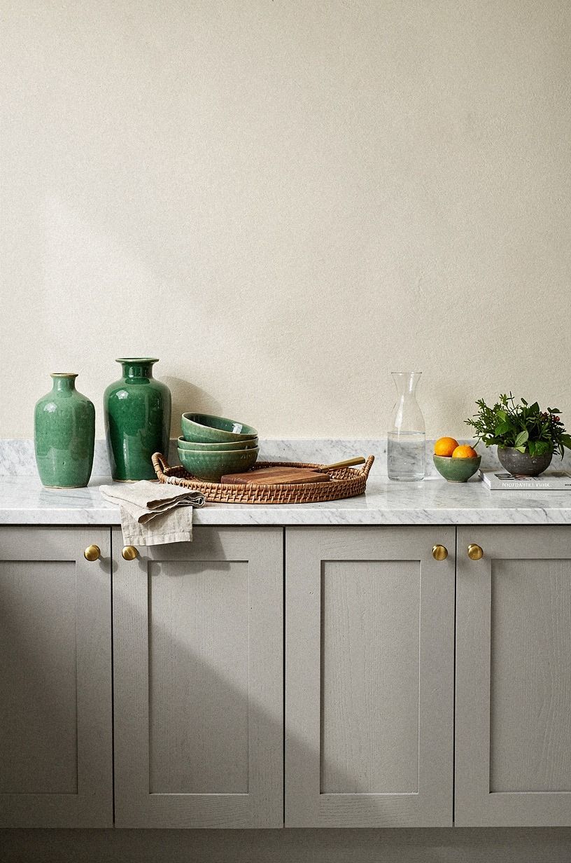 Pair dove gray cabinets with marble counters