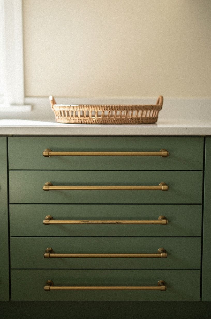 Long bronze bars repeated down a drawer wall