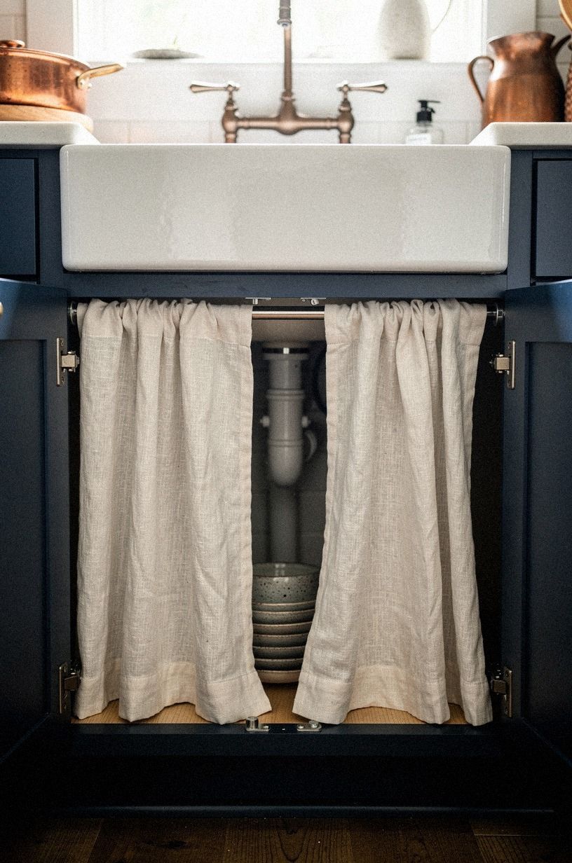 Add tension rods inside exposed base cabinets