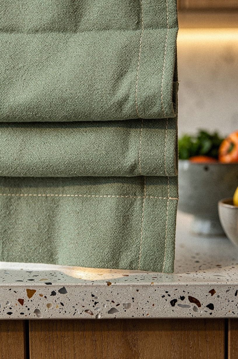 Match cabinet curtains to the kitchen roman shade