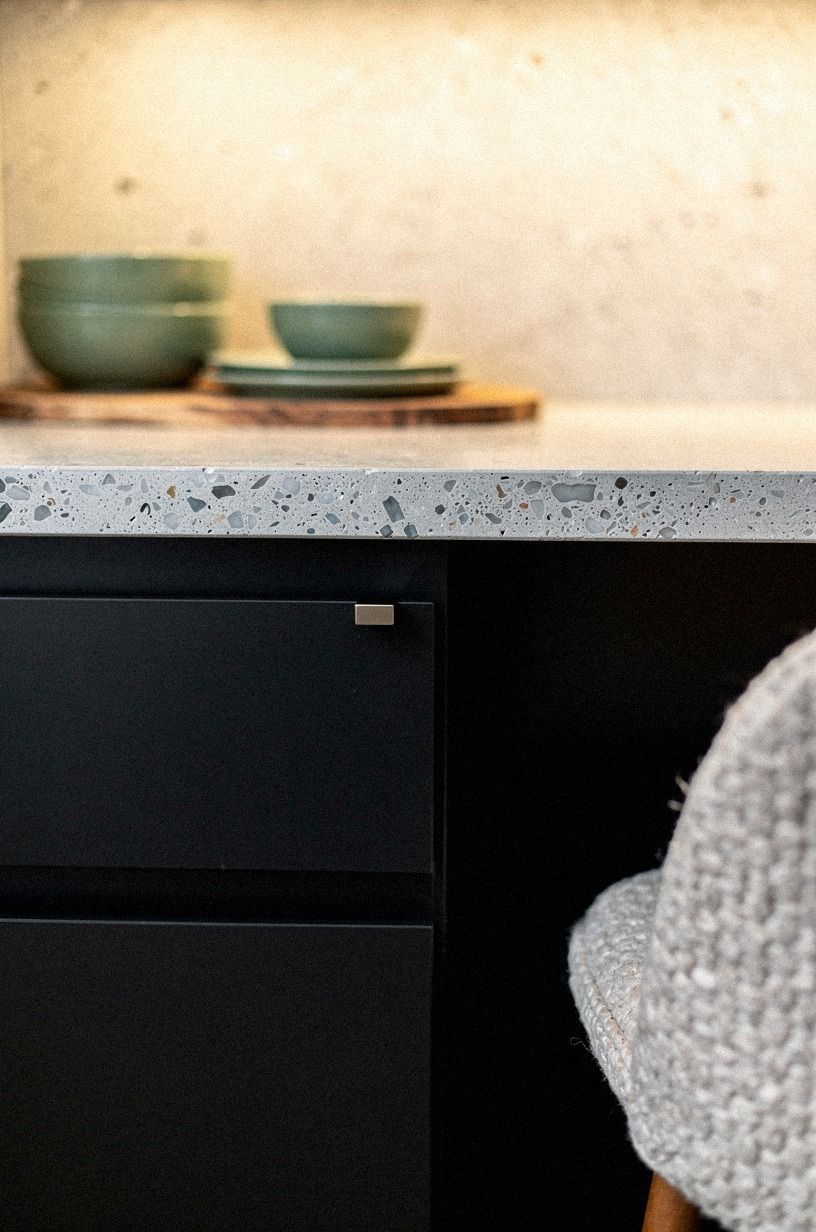 Build contrast with black lower cabinets instead of going full black