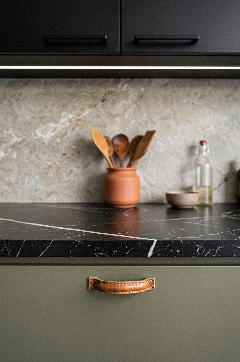 I matched black fixtures to modern cabinet pulls